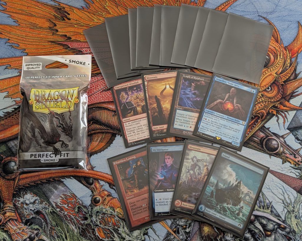 Perfect Fit Smoke sleeves by Dragon Shield. Top row is the sleeves, middle row is cards sleeved only in the Perfect Fit Smoke sleeves, and the bottom row is sleeved in the Perfect Fits and regular Dragon Shield sleeves.